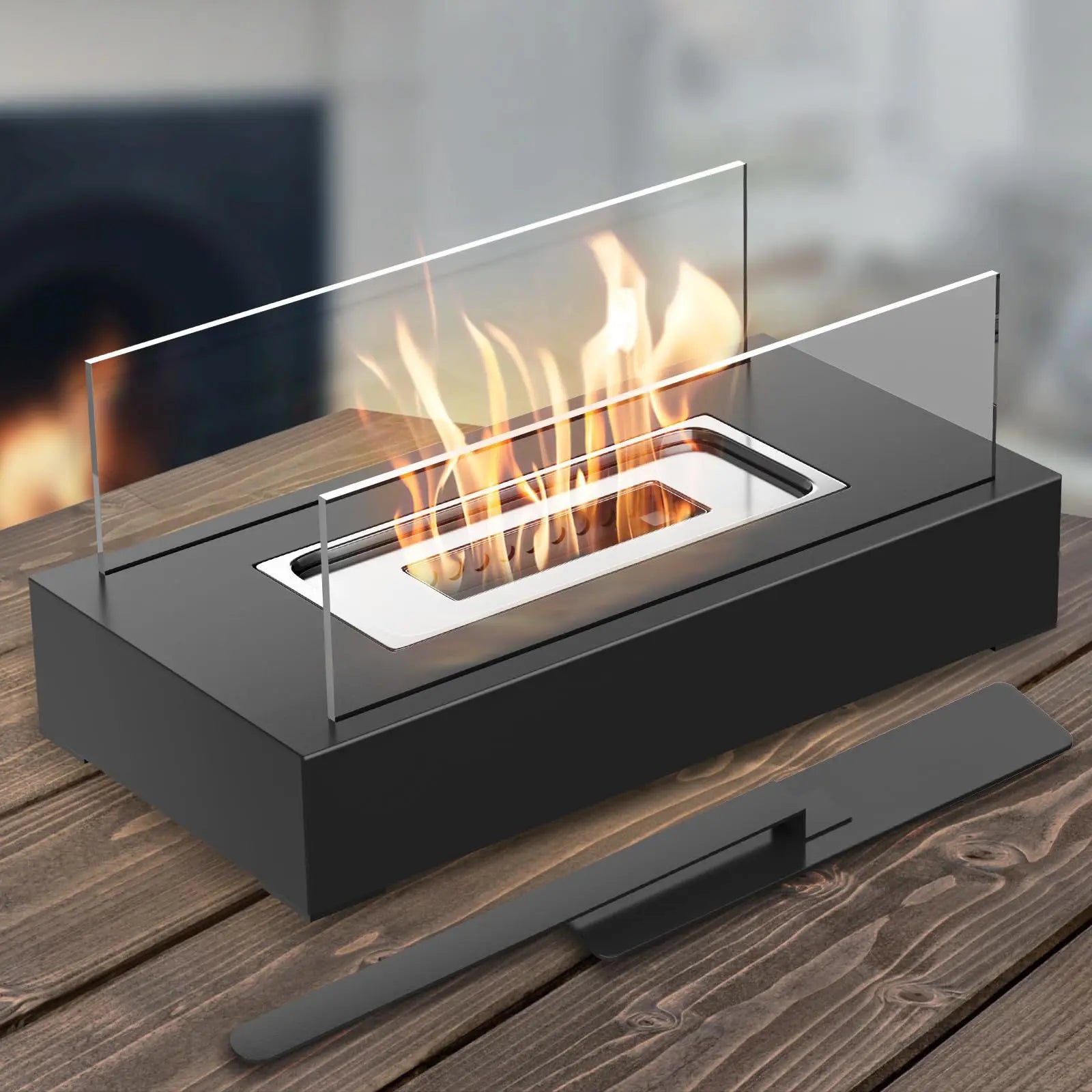 Tabletop ethanol fireplace with flames on a wooden surface