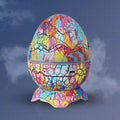 Colorful egg-shaped humidifier with a cracked pattern on a dark background