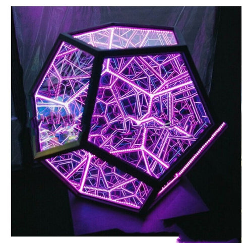 Geometric LED light panel with a spider web design on a dark background